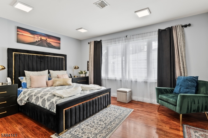 231 Starmond Avenue Clifton, NJ 07013 - Photo 18 of 32 a bedroom with a bed and a window