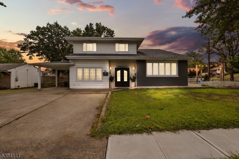 231 Starmond Avenue Clifton, NJ 07013 - Photo 30 of 32 a front view of a house with garden