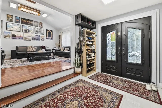 a living room with furniture and a rug