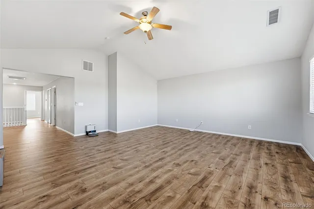 a view of a kitchen with a sink and a window