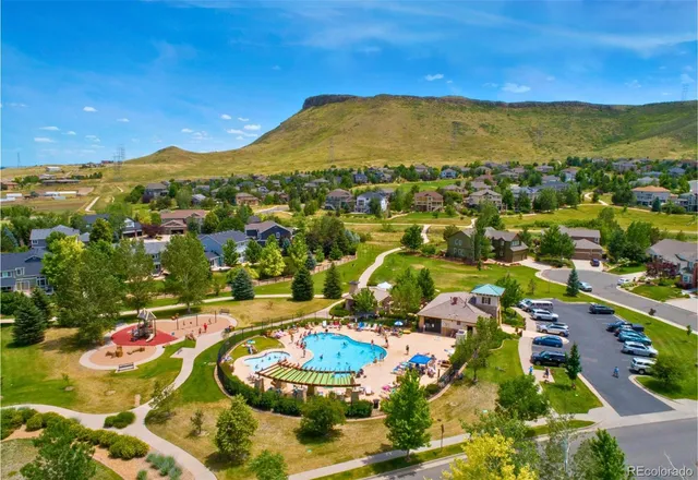 a view of a swimming pool with a table and chairs