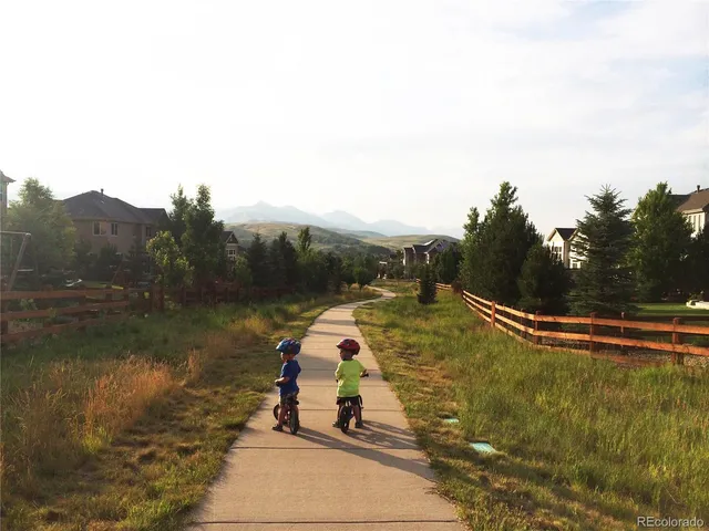a view of a sign board with a street