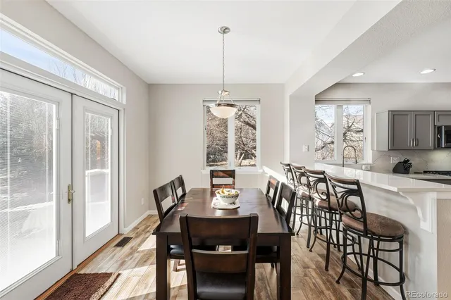 a view of a dining room with furniture window and outside view