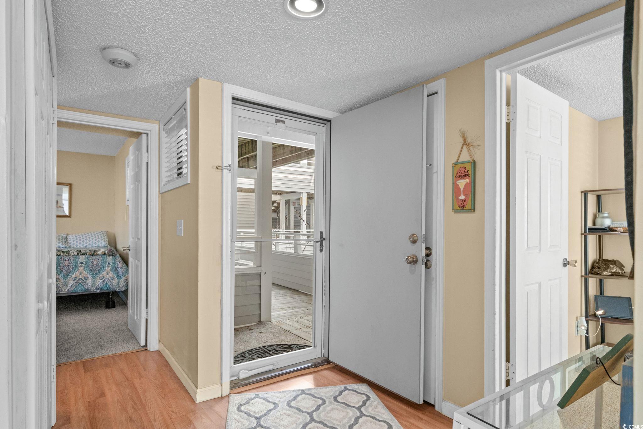 351 Lake Arrowhead Road, Unit 20179 Myrtle Beach, SC 29572 - Photo 11 of 40 Entrance foyer featuring a textured ceiling and light wood-style flooring