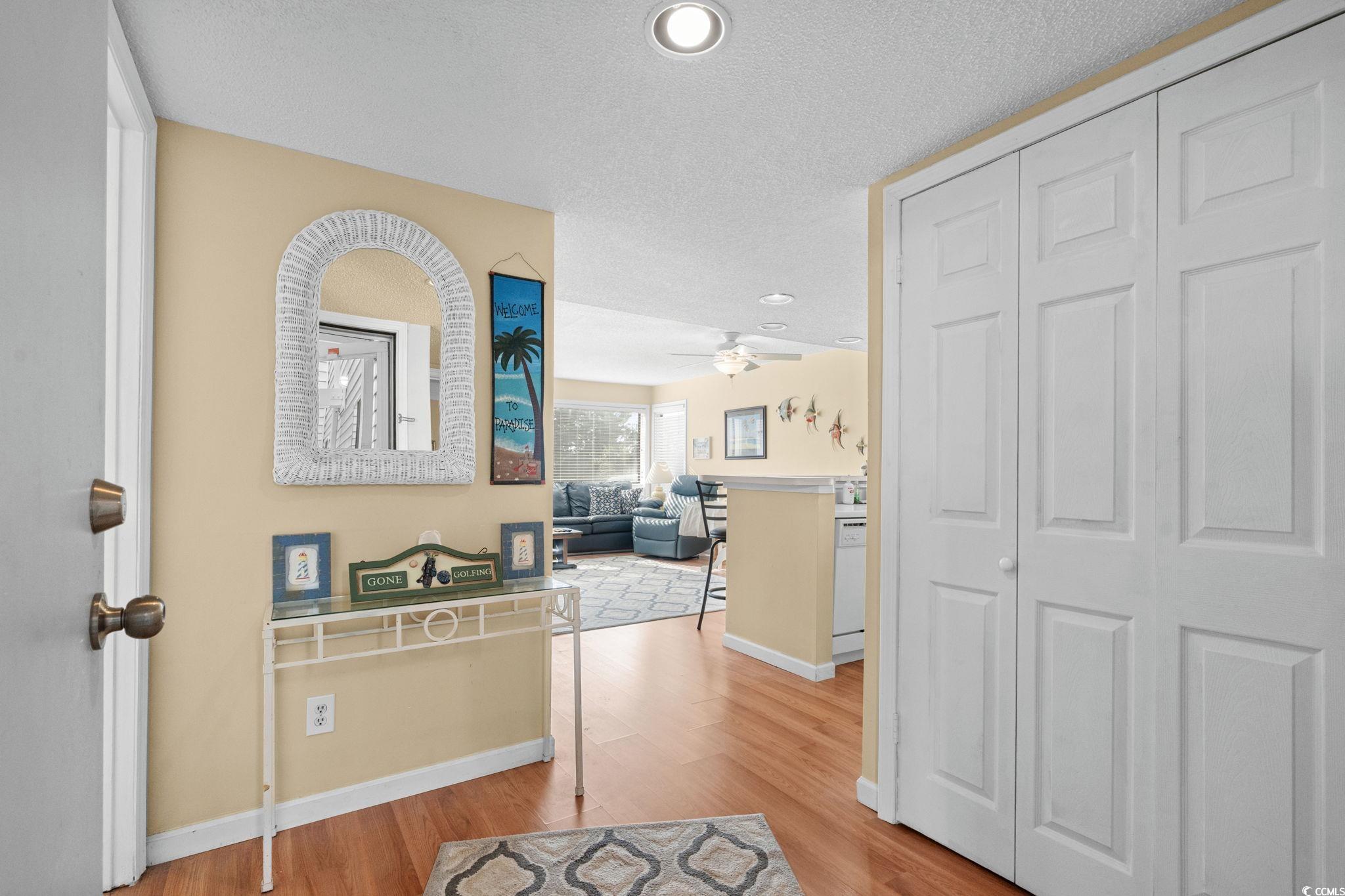 351 Lake Arrowhead Road, Unit 20179 Myrtle Beach, SC 29572 - Photo 12 of 40 Hall with light wood-style flooring, recessed lighting, and a textured ceiling