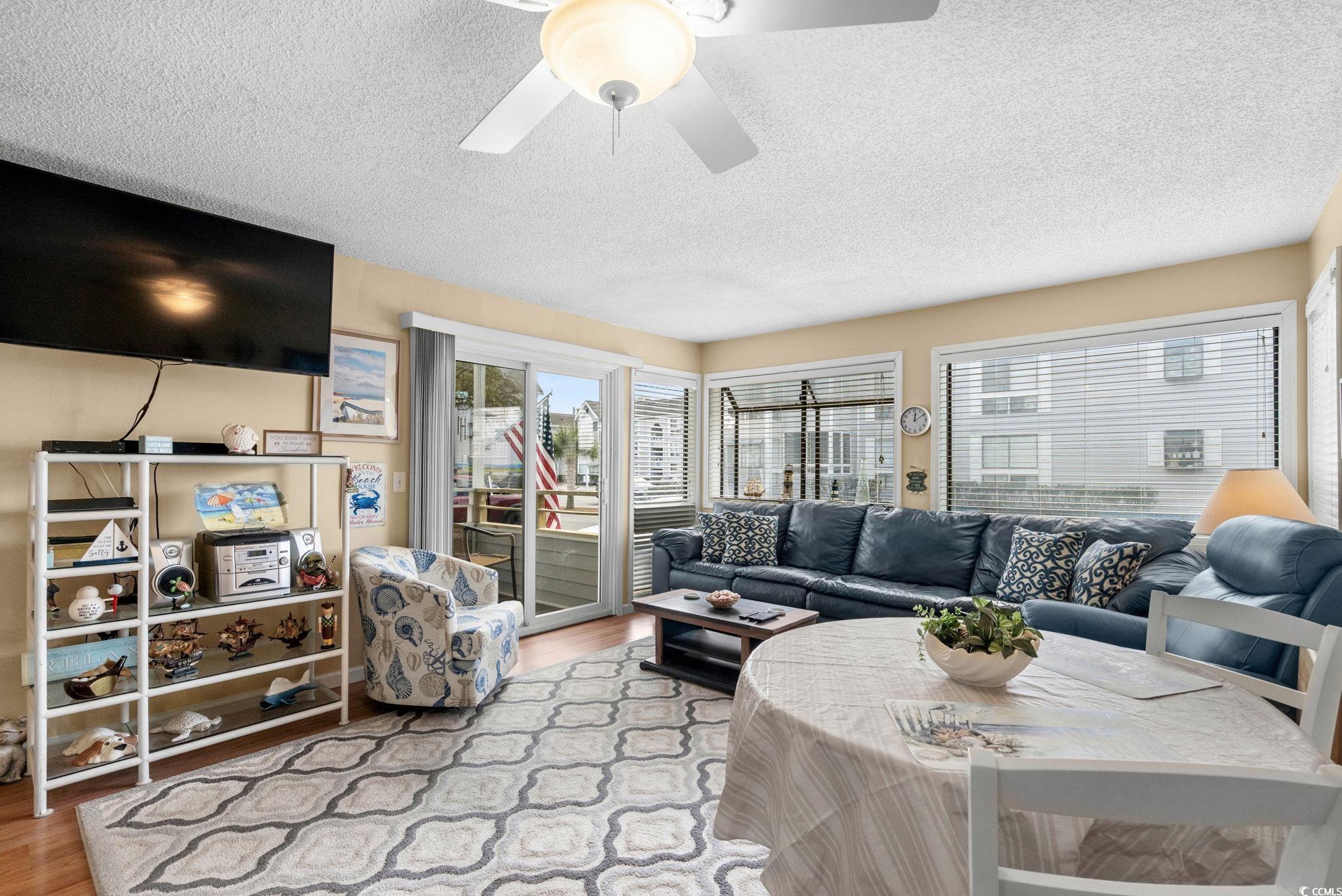 351 Lake Arrowhead Road, Unit 20179 Myrtle Beach, SC 29572 - Photo 15 of 40 Living room with a textured ceiling and light wood-style floors