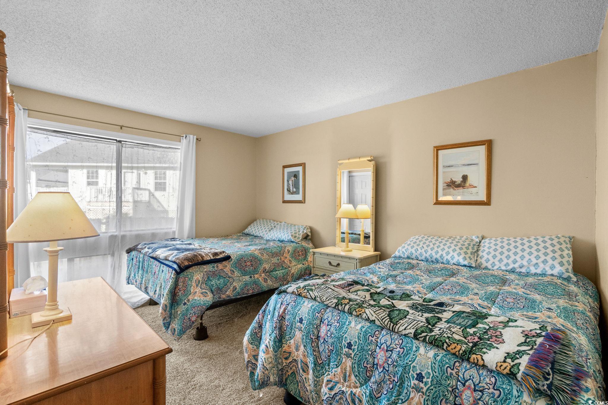 351 Lake Arrowhead Road, Unit 20179 Myrtle Beach, SC 29572 - Photo 10 of 40 Bedroom featuring carpet flooring and a textured ceiling