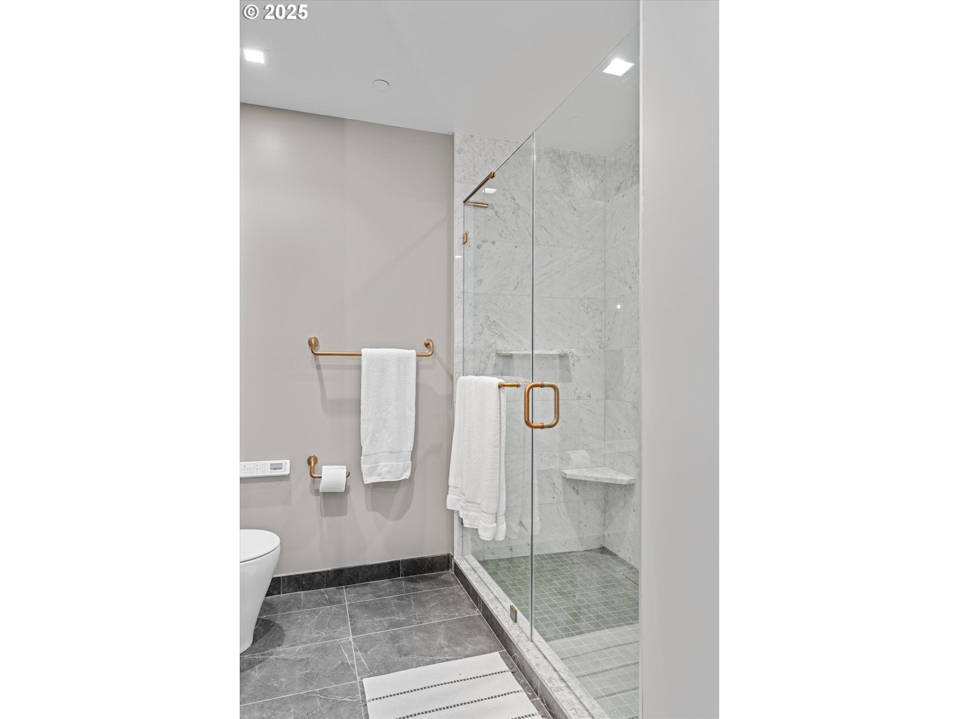 590 Waterfront Way, Unit 700 Vancouver, WA 98660 - Photo 12 of 35 a bathroom with a toilet and a shower