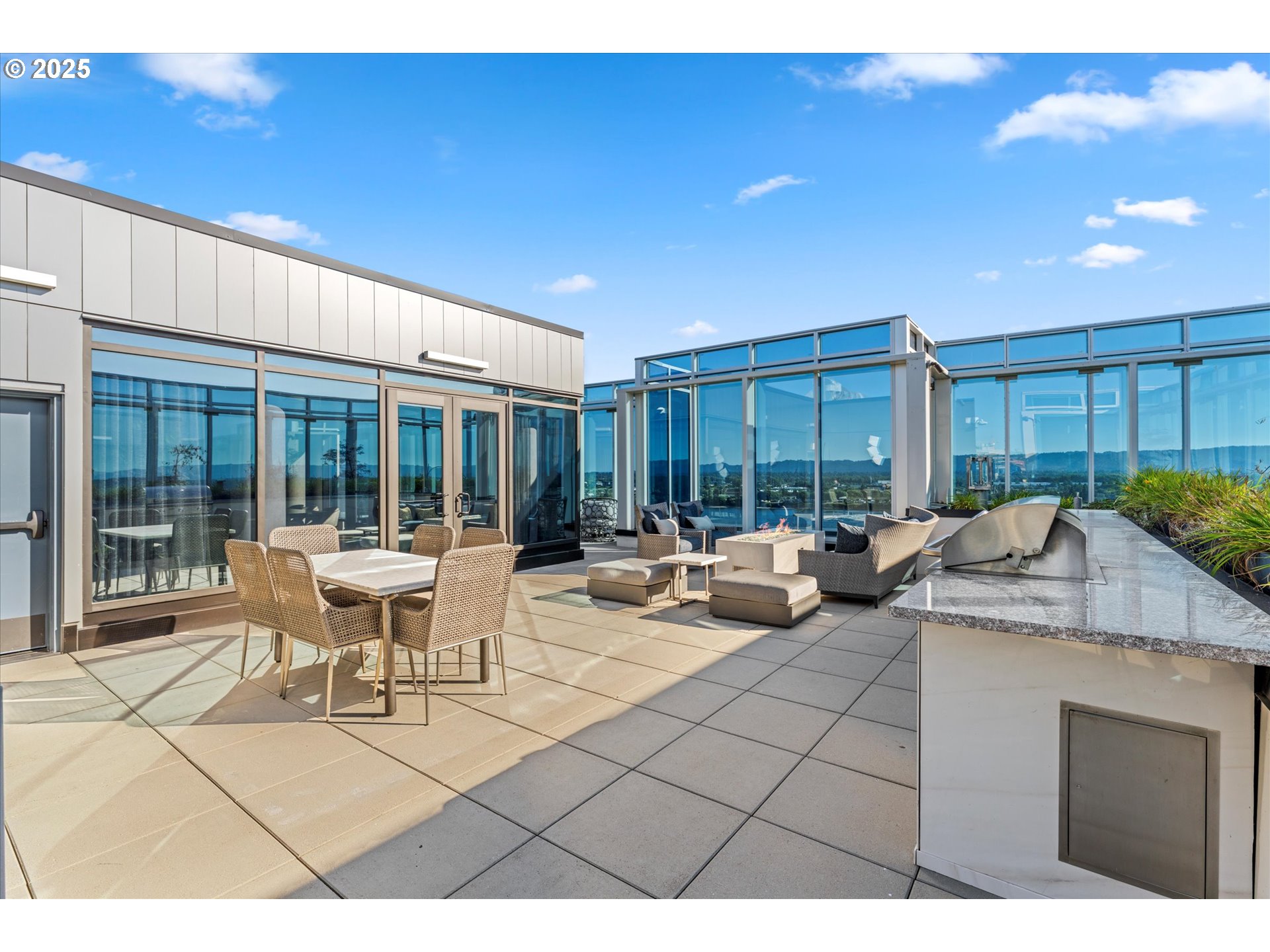 590 Waterfront Way, Unit 700 Vancouver, WA 98660 - Photo 25 of 35 a living room with furniture a large window and a table