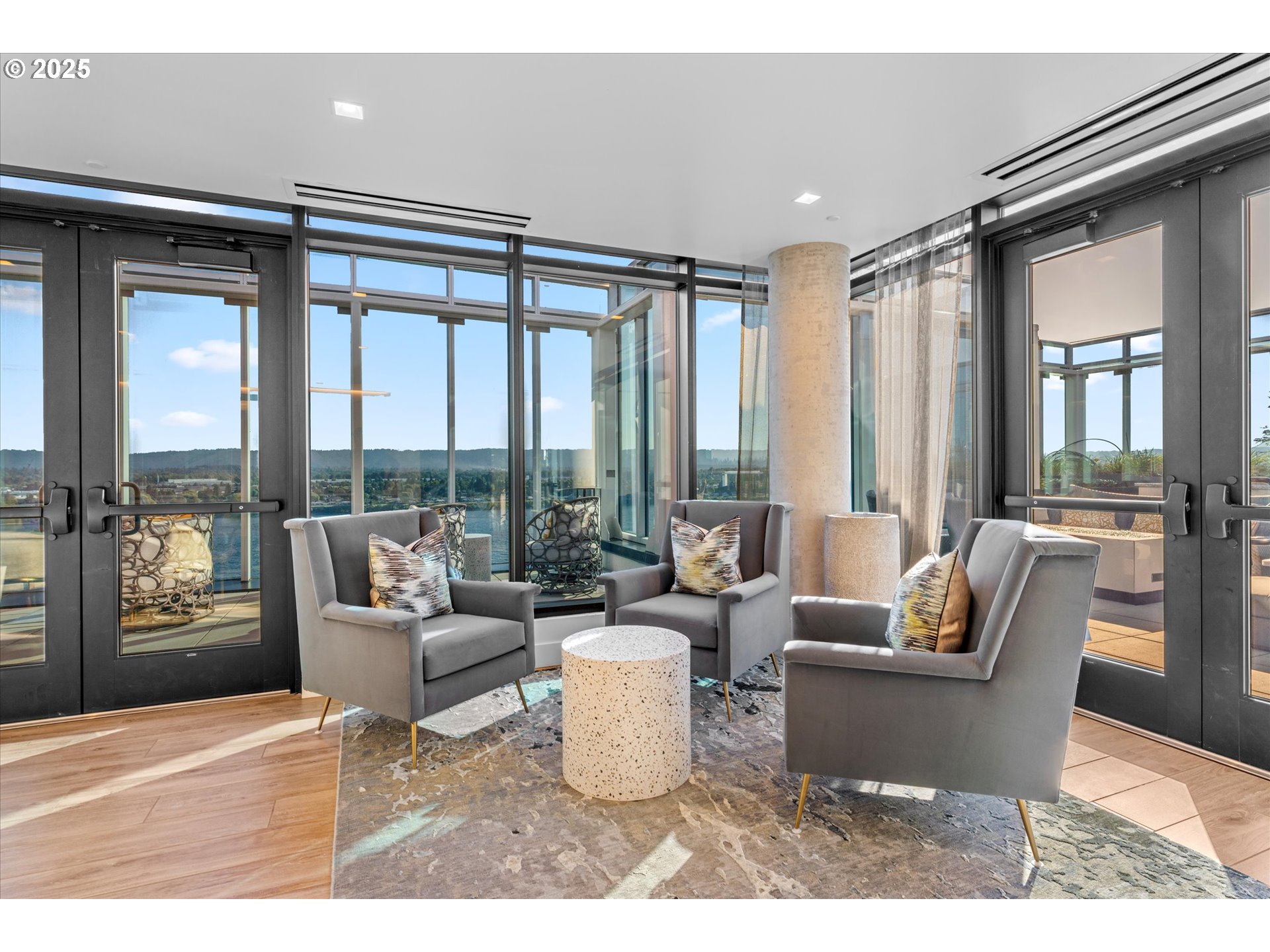 590 Waterfront Way, Unit 700 Vancouver, WA 98660 - Photo 31 of 35 a living room with furniture and large windows