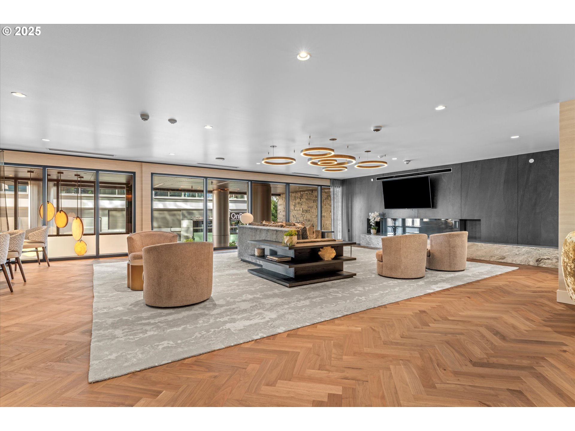 590 Waterfront Way, Unit 700 Vancouver, WA 98660 - Photo 32 of 35 a living room with furniture a flat screen tv and a large window
