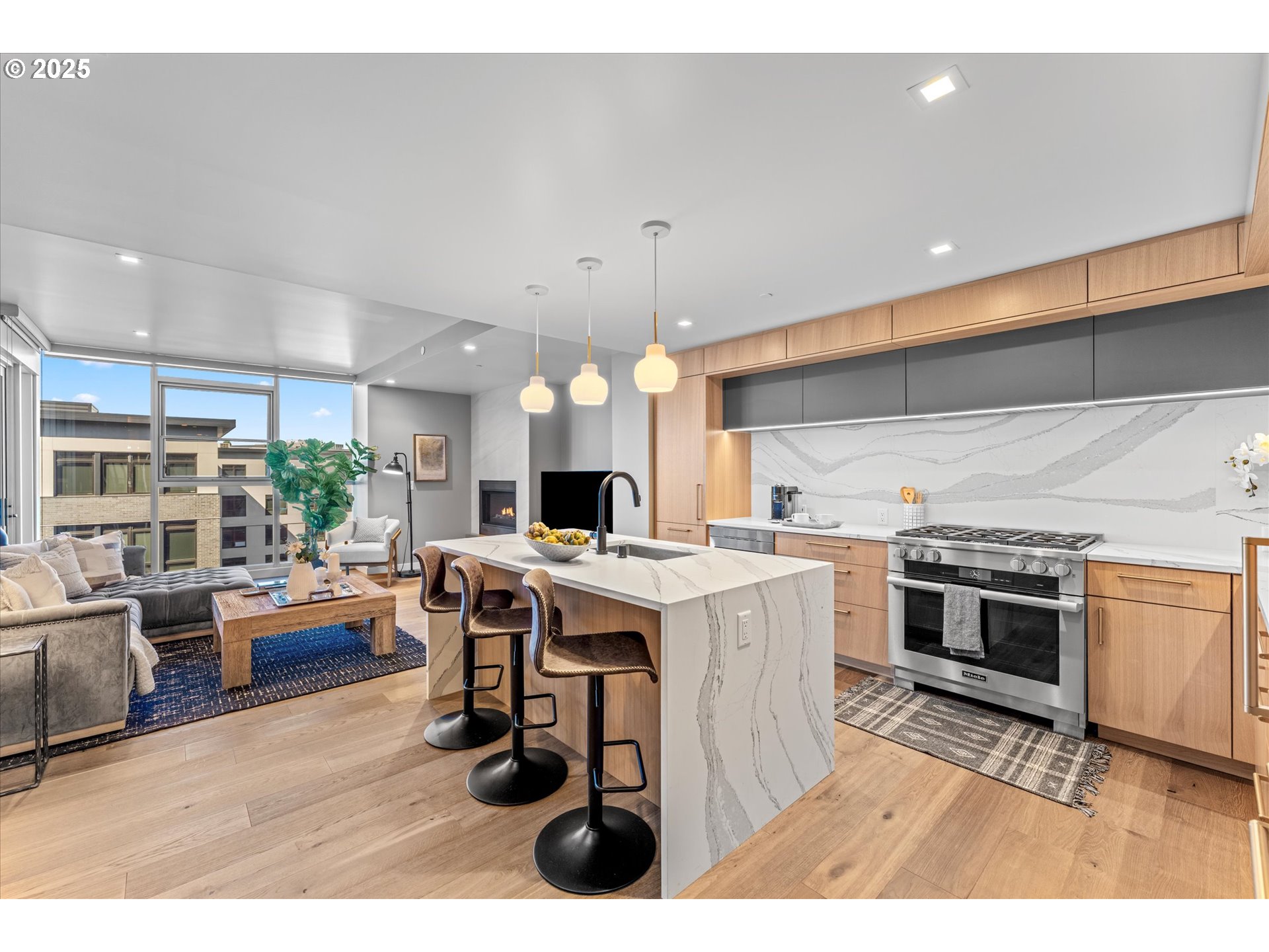 590 Waterfront Way, Unit 700 Vancouver, WA 98660 - Photo 5 of 35 a kitchen with stainless steel appliances kitchen island granite countertop lots of counter top space
