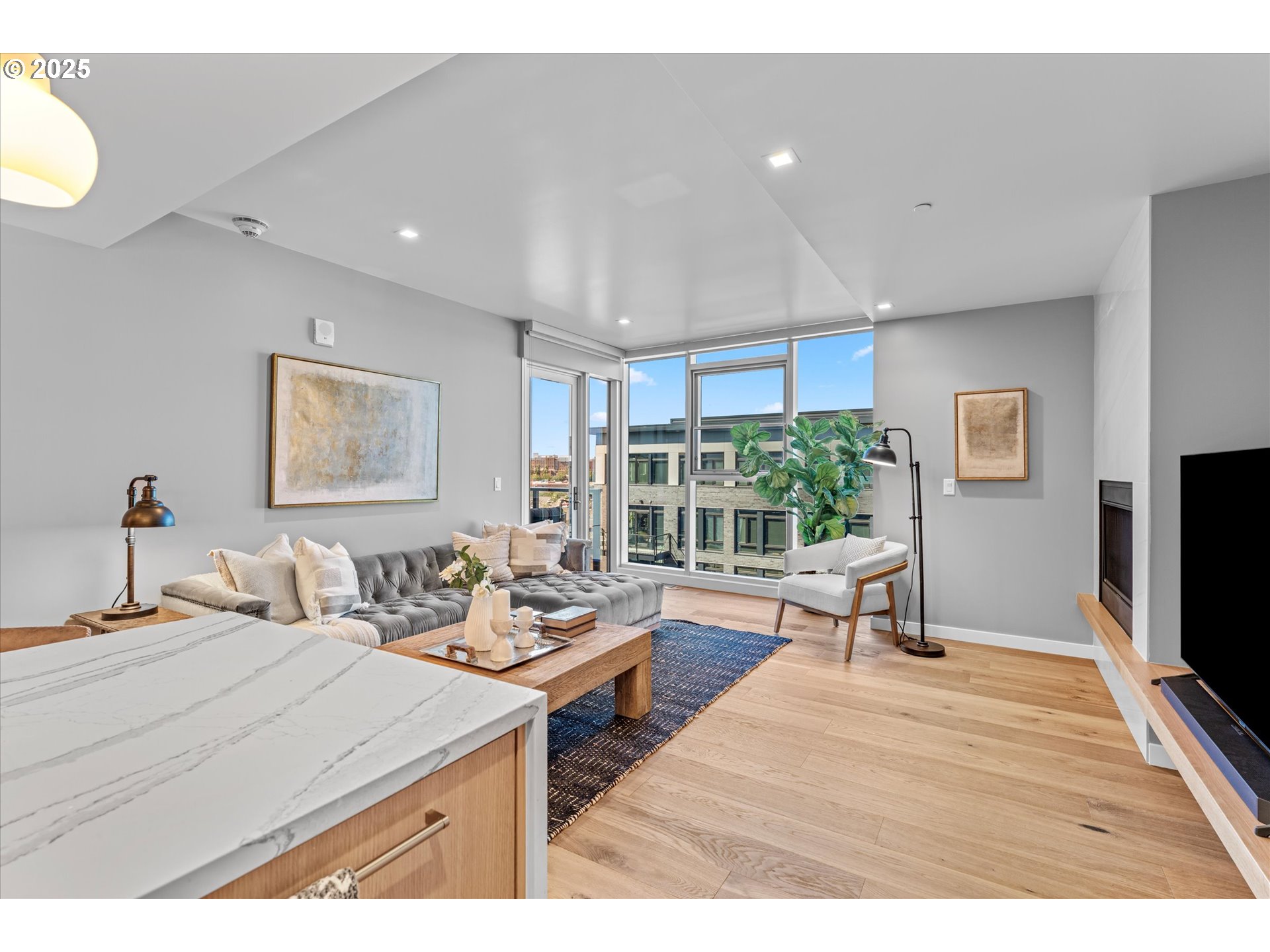 590 Waterfront Way, Unit 700 Vancouver, WA 98660 - Photo 8 of 35 a bedroom with furniture and a flat screen tv