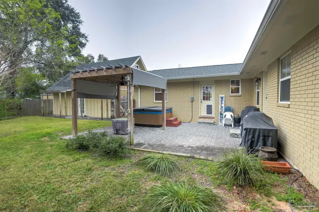 a house view with a backyard space
