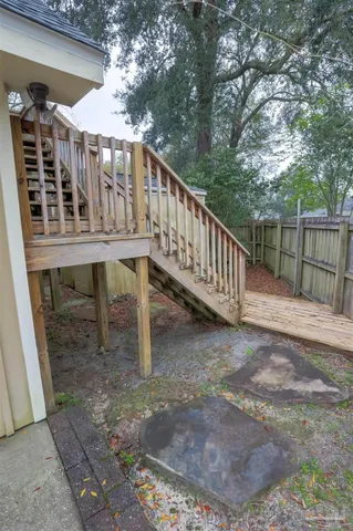 a balcony with wooden floor and fence