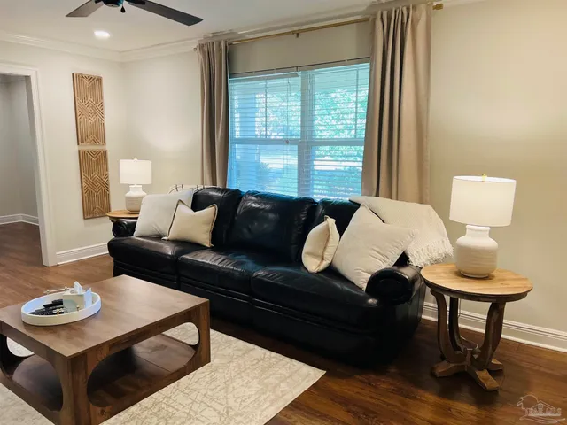a living room with furniture and a window