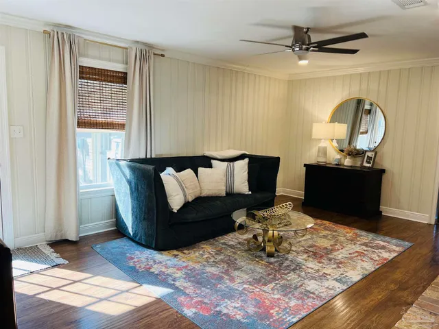 a living room with furniture and a rug