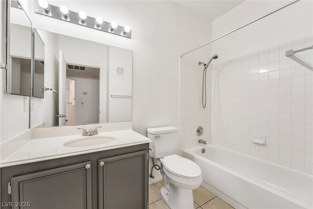 2201 Ramsgate Drive, Unit 811 Henderson, NV 89074 - Photo 25 of 36 Functional full bathroom featuring a tub-shower combo and a classic single vanity.