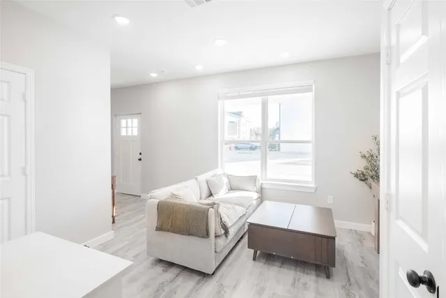 a spacious bedroom with a bed and a couch