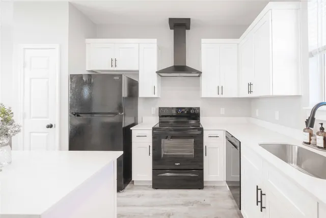 a bathroom with a tub sink and toilet