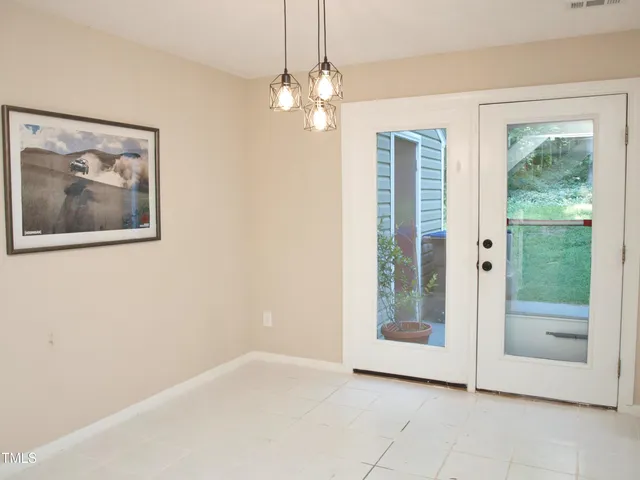 a bedroom with a bed and chair