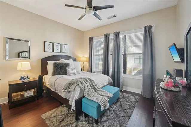 a bedroom with a bed and a mirror