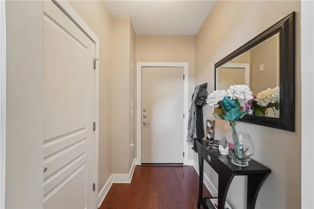 a living room with fireplace furniture and a wooden floor