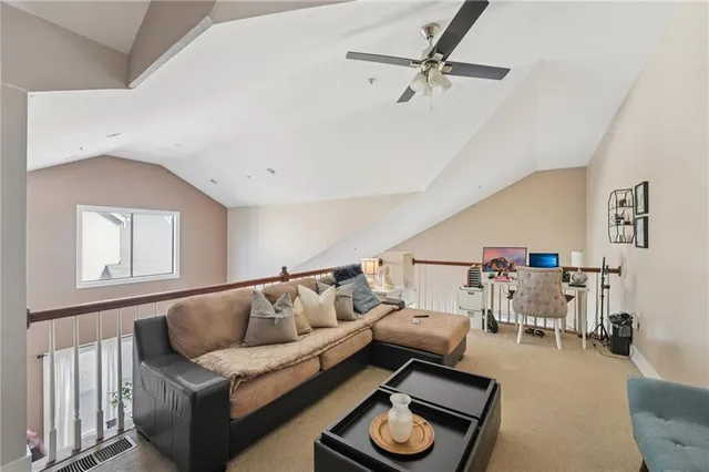 a bedroom with furniture and a flat screen tv