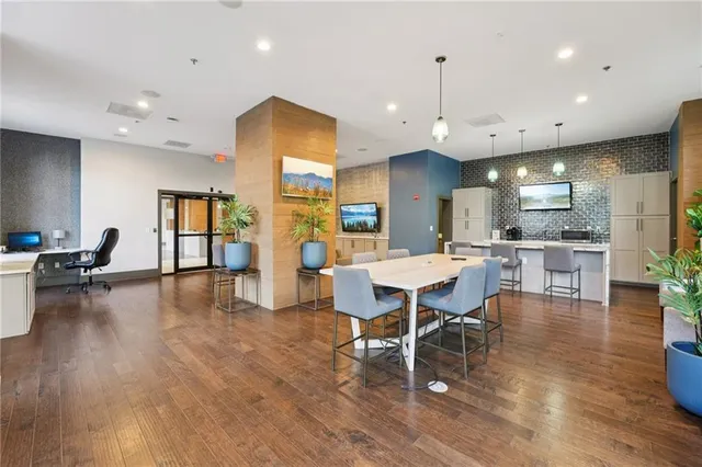 a large kitchen with kitchen island a large island in it