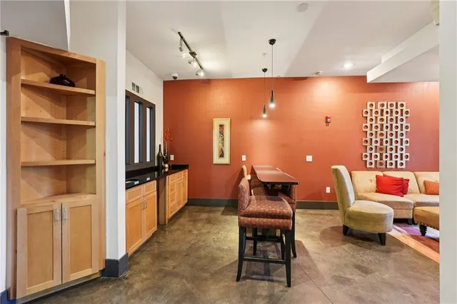 a front view of a building with garden