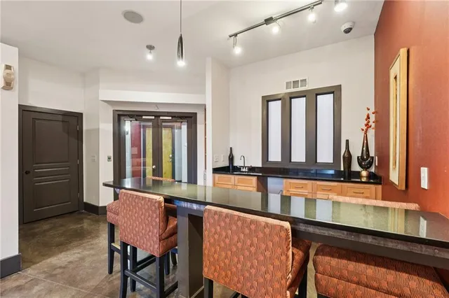 a view of a backyard with table and chairs