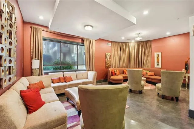 a view of a patio with a table chairs and a backyard