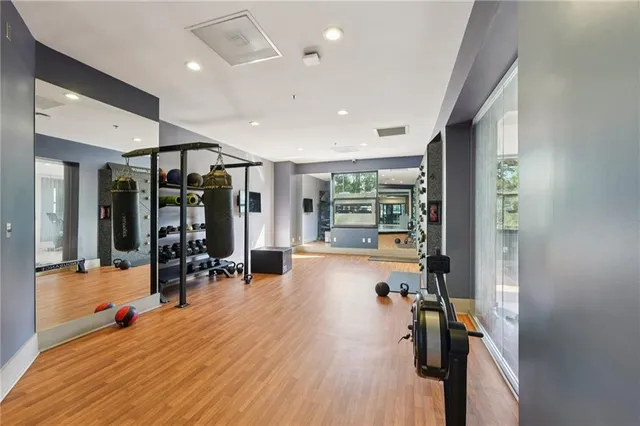 a view of a patio with table and chairs and wooden floor