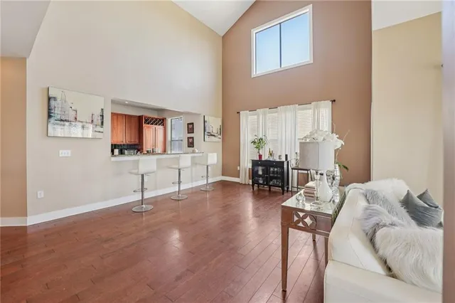 a view of a livingroom with furniture and a kitchen