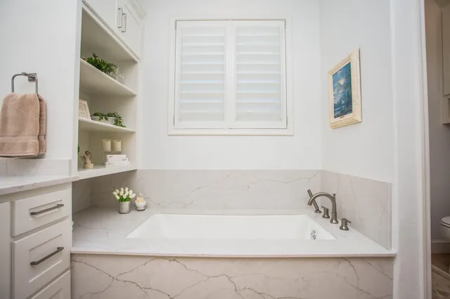 a bathroom with a toilet and a sink