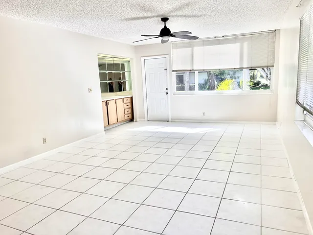 a view of an empty room and a window