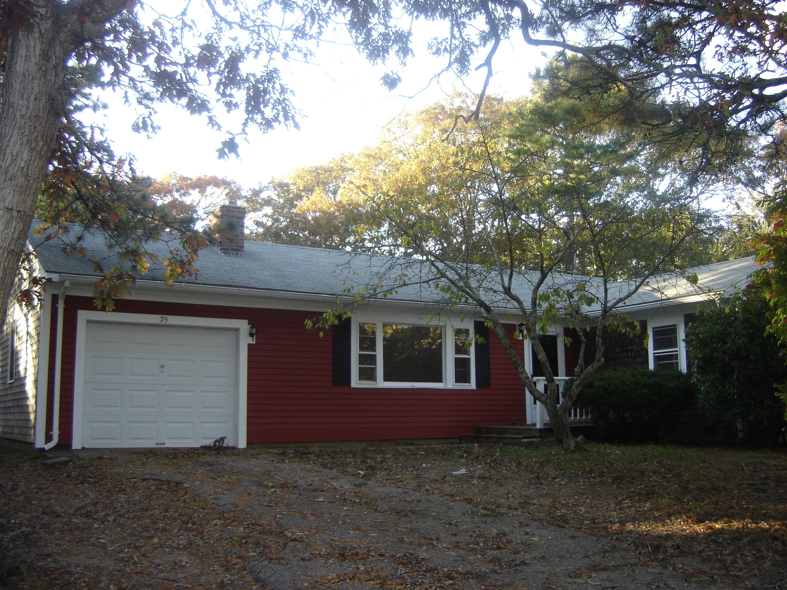 75 Quaker Road Hyannis, MA 02601 - Photo 1 of 28 a view of a house with a yard