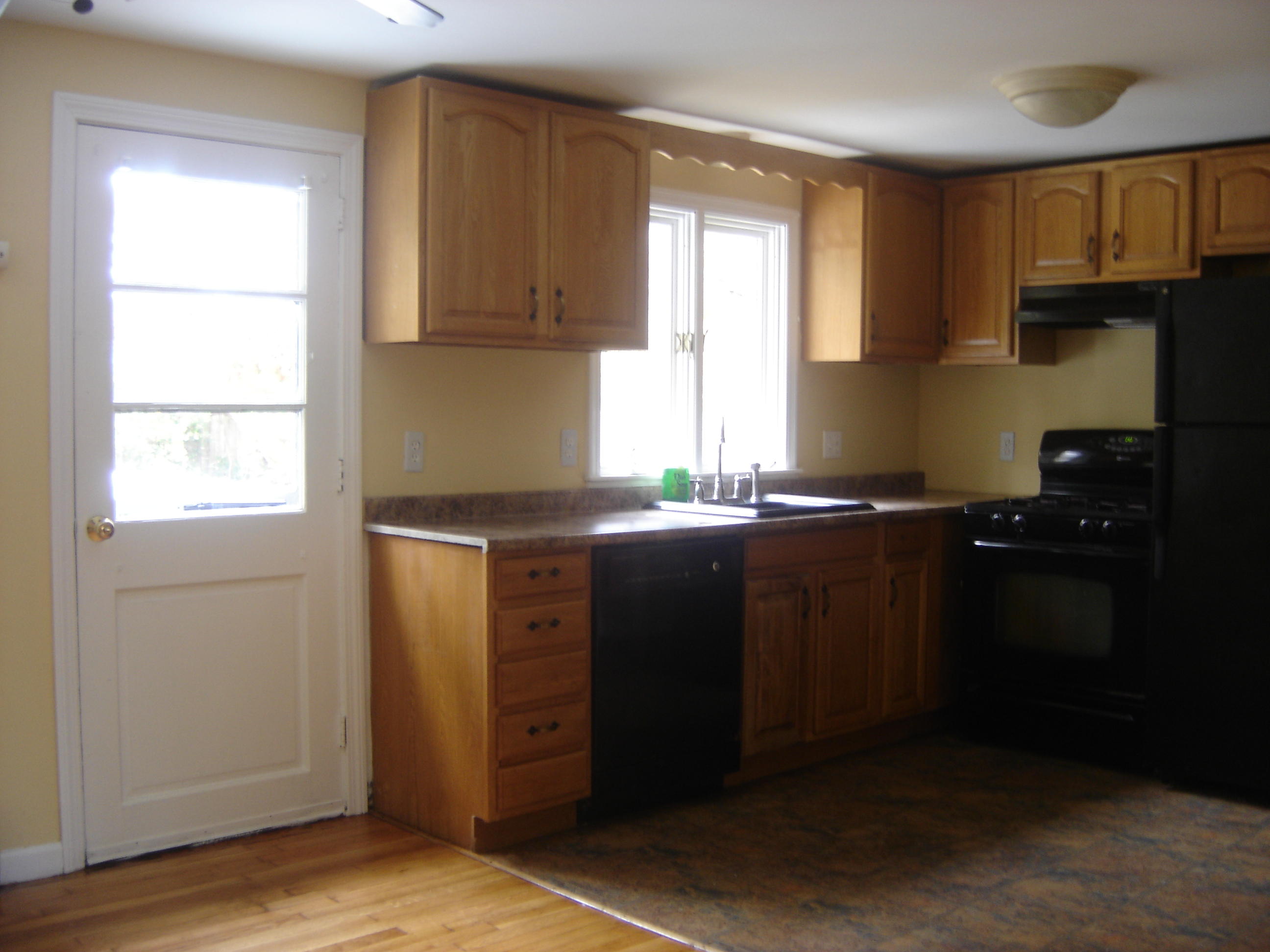 75 Quaker Road Hyannis, MA 02601 - Photo 11 of 28 a kitchen with granite countertop cabinets stainless steel appliances and a window