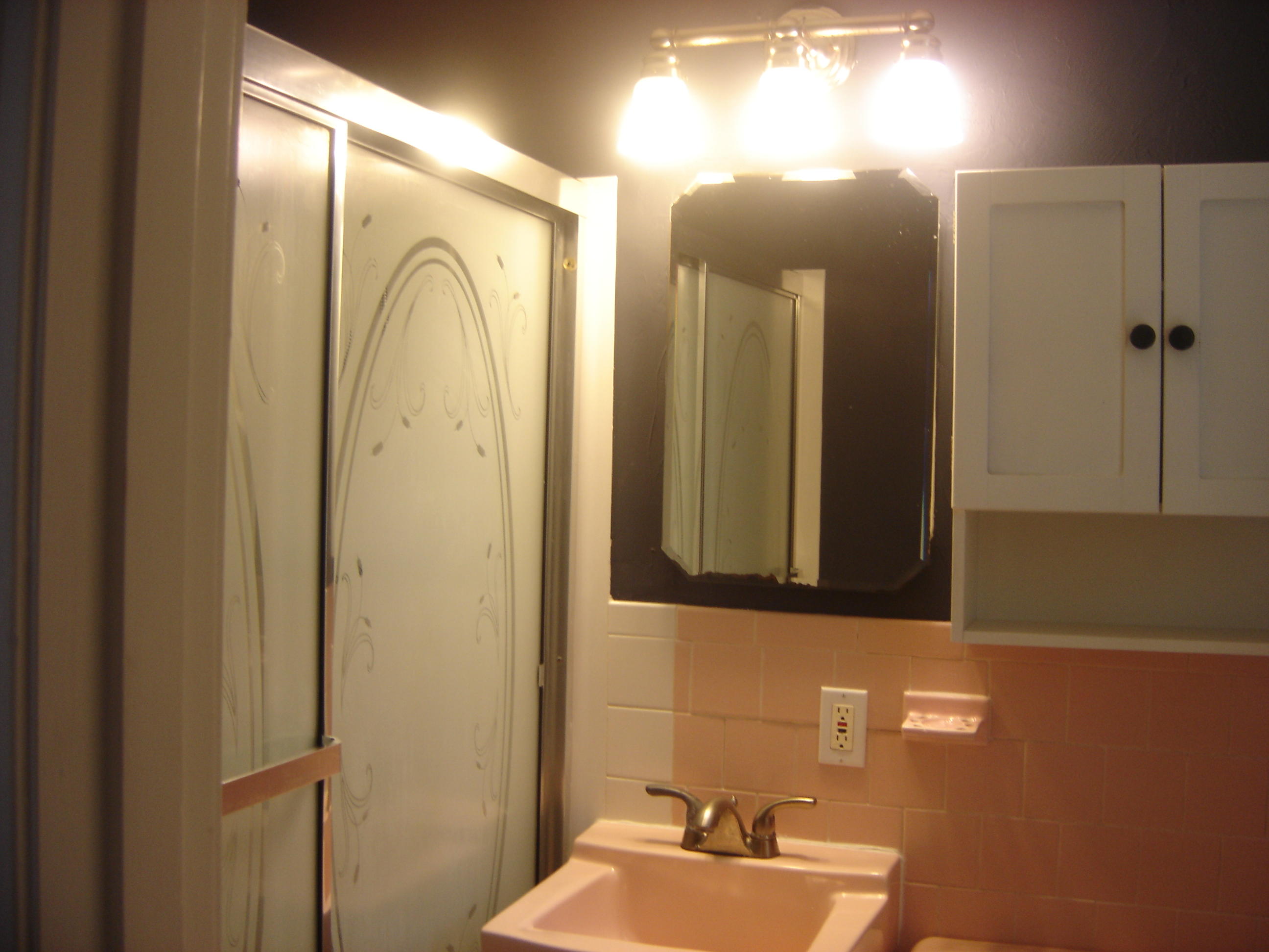 75 Quaker Road Hyannis, MA 02601 - Photo 17 of 28 a bathroom with a sink mirror and vanity