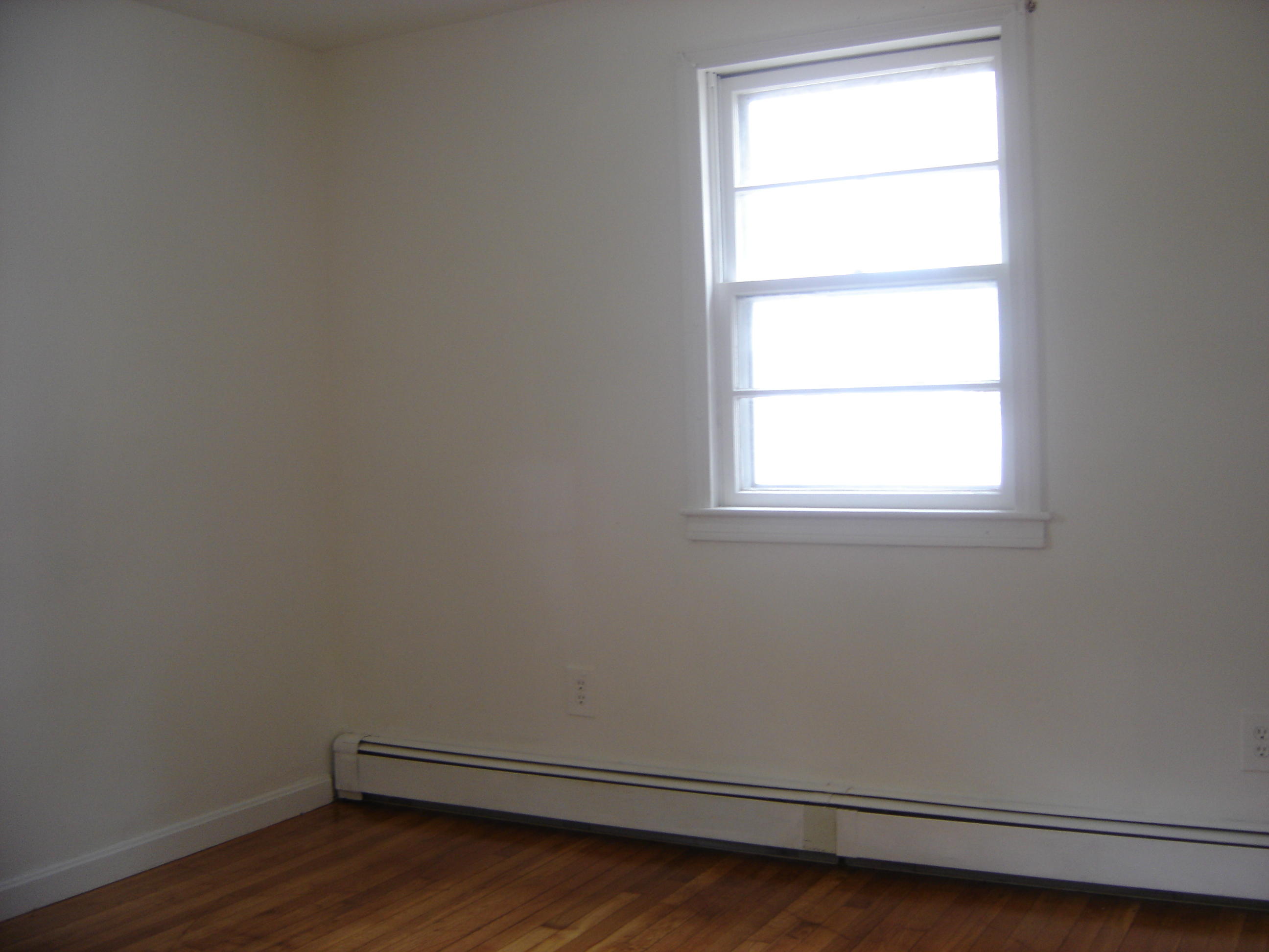 75 Quaker Road Hyannis, MA 02601 - Photo 20 of 28 a view of a small space with wooden floor and a window