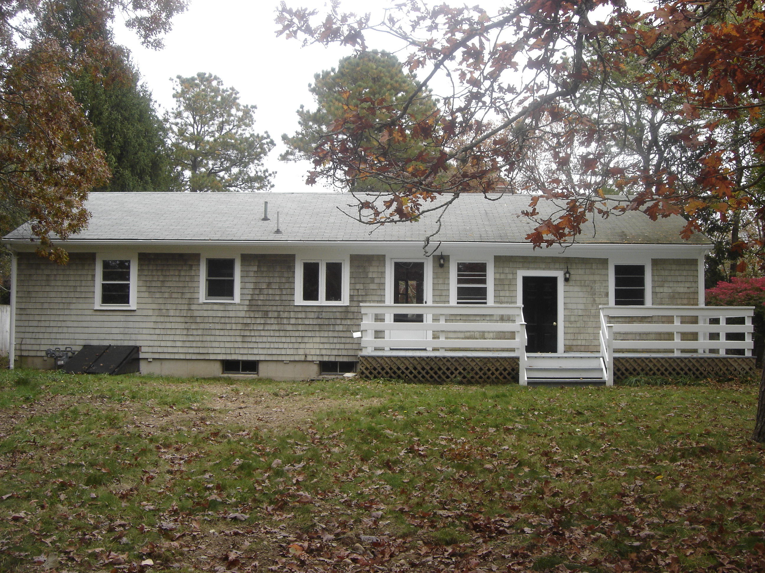 75 Quaker Road Hyannis, MA 02601 - Photo 27 of 28 a front view of a house with yard