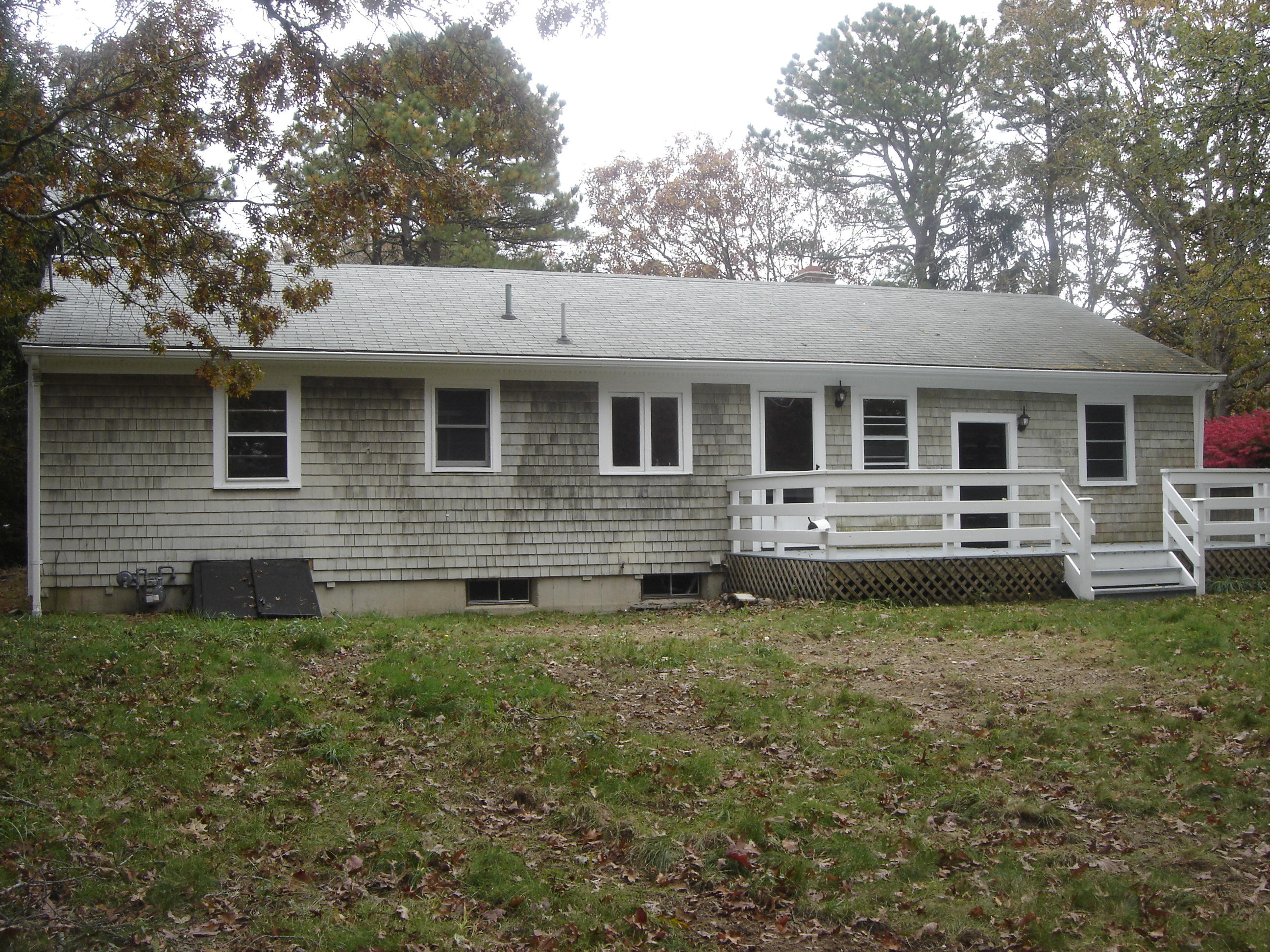 75 Quaker Road Hyannis, MA 02601 - Photo 28 of 28 a front view of a house with garden