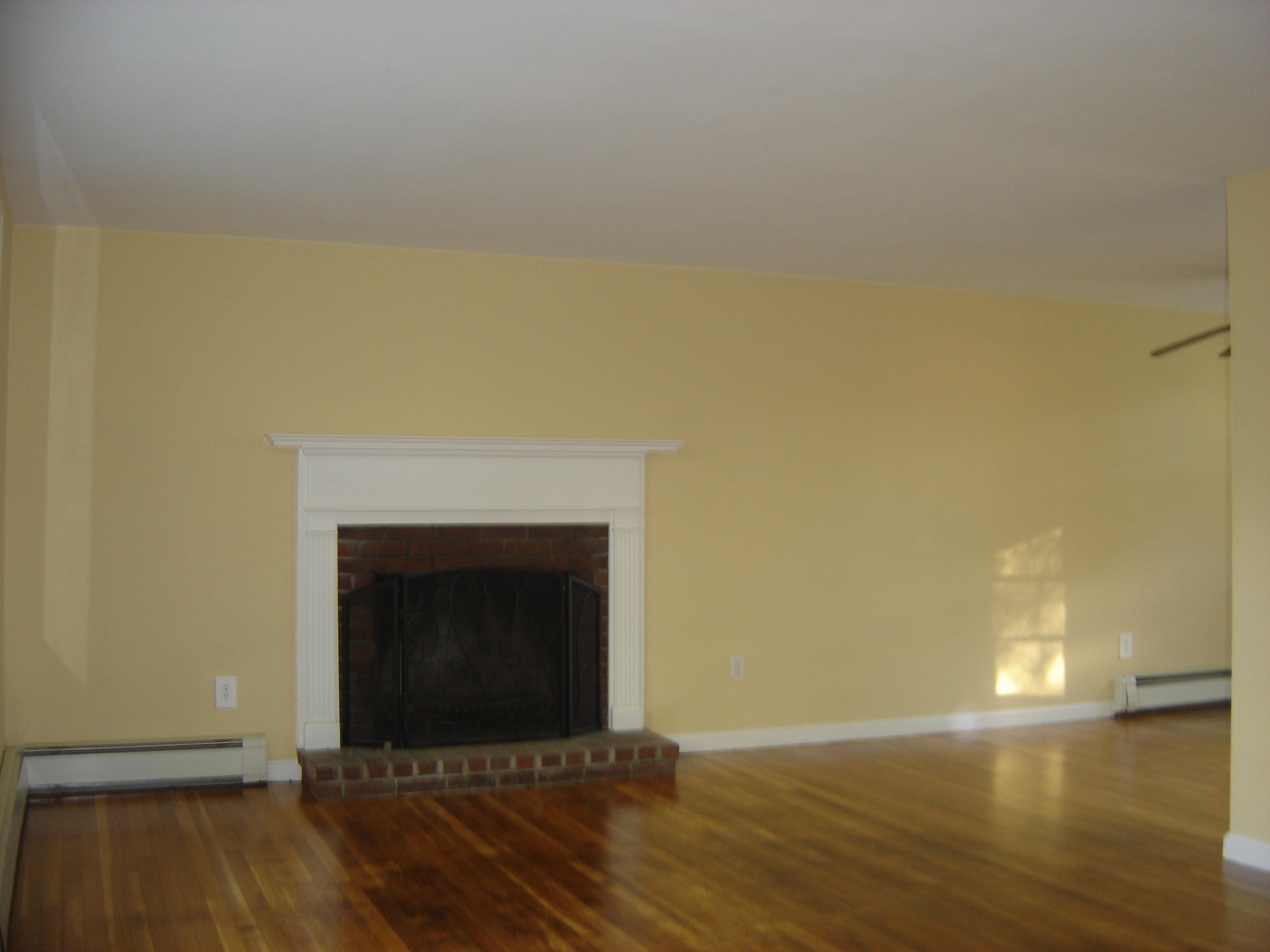 75 Quaker Road Hyannis, MA 02601 - Photo 4 of 28 a living room with a fireplace