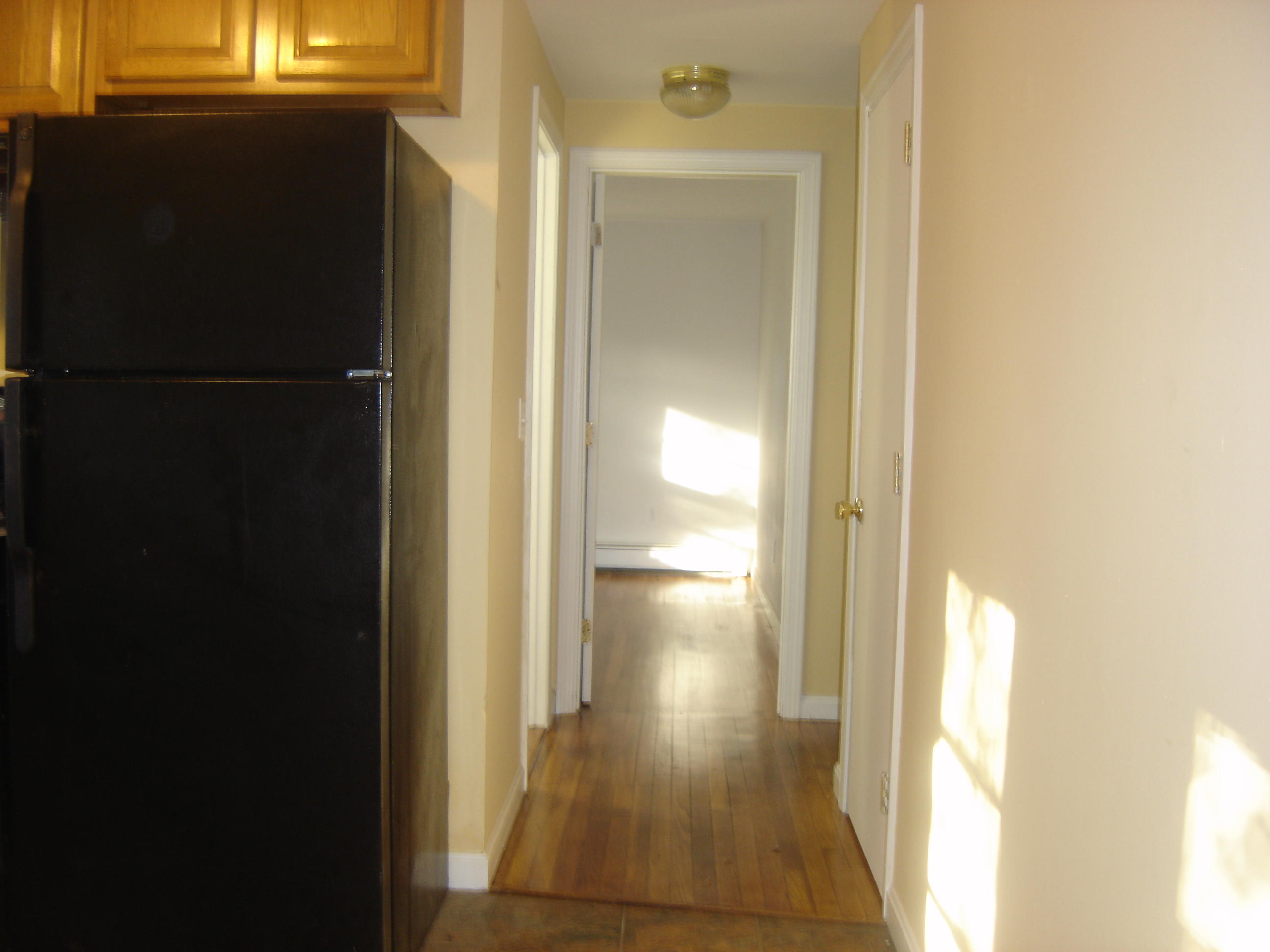 75 Quaker Road Hyannis, MA 02601 - Photo 7 of 28 a view of a bathroom from a hallway