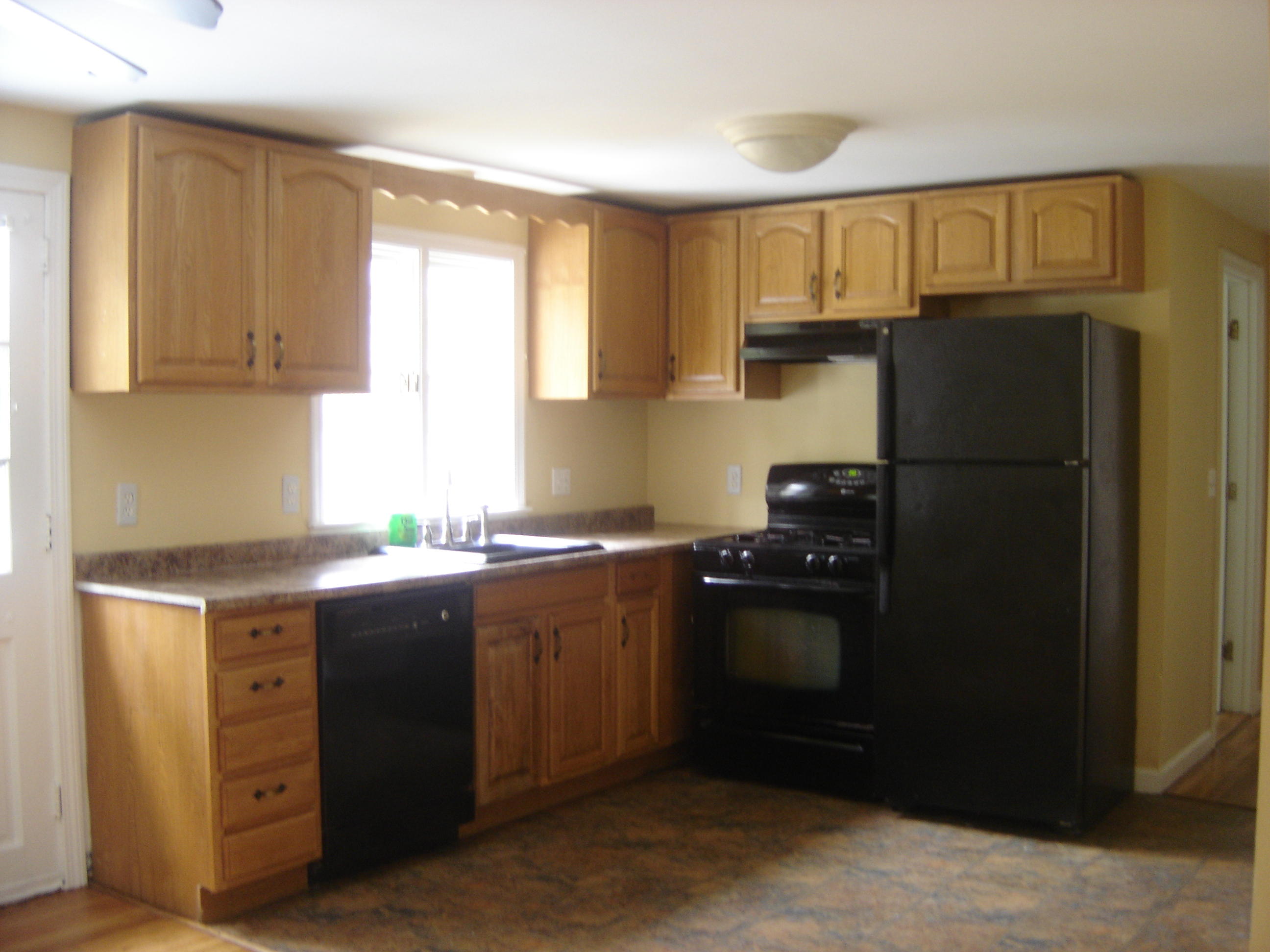 75 Quaker Road Hyannis, MA 02601 - Photo 10 of 28 a kitchen with stainless steel appliances granite countertop a refrigerator and a sink