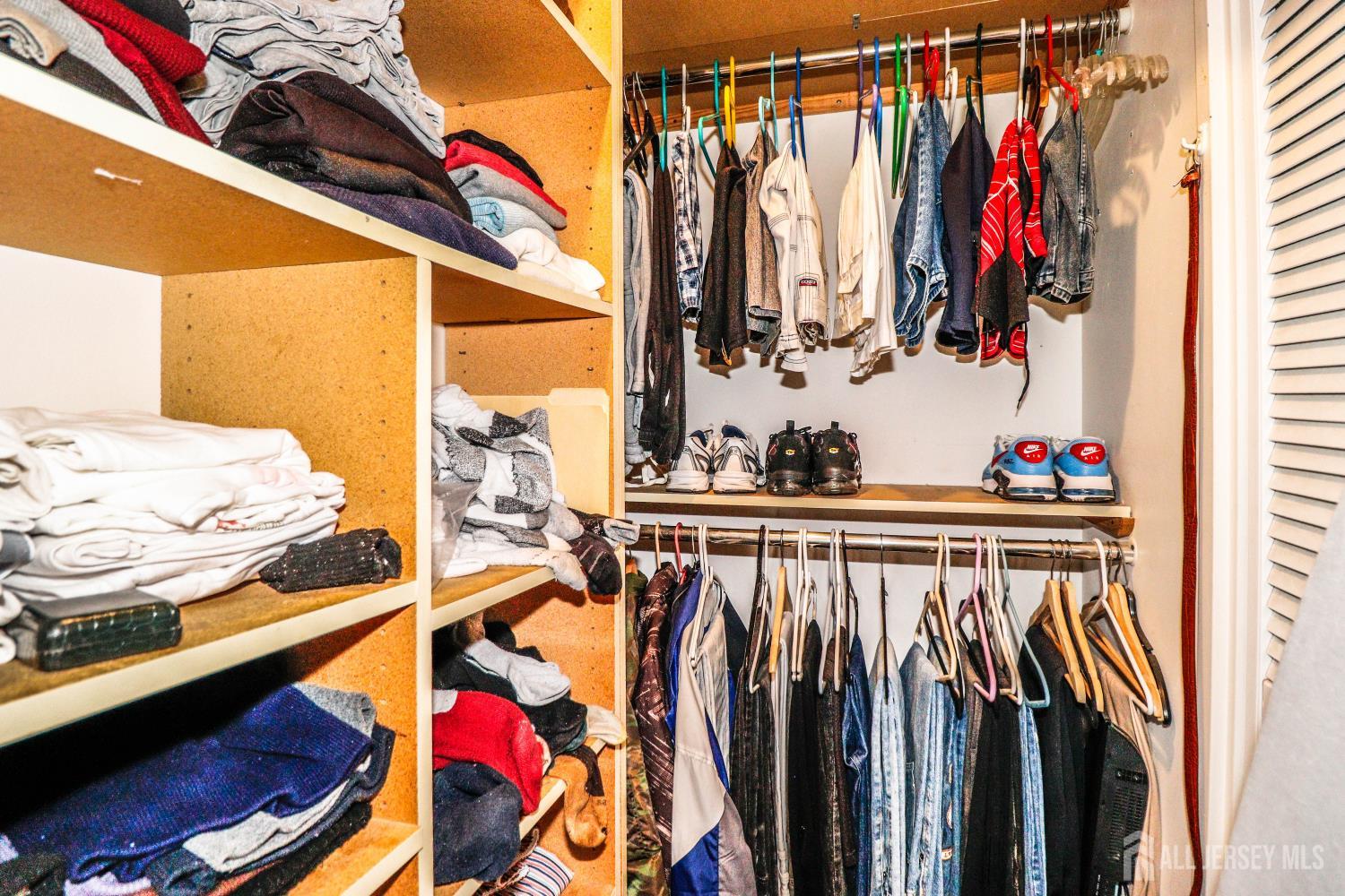 40 Fayette Street, Unit 57 Perth Amboy, NJ 08861 - Photo 27 of 33 a view of walk in closet with clothes and shoes
