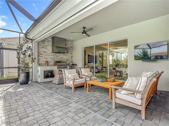 a spacious bedroom with a bed and a chandelier