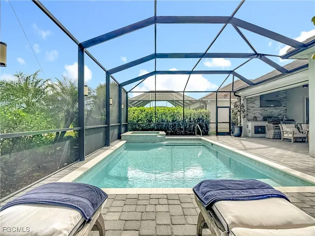 a living room with a couch and a large window