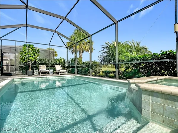 a bathroom with a granite countertop sink a shower and a mirror