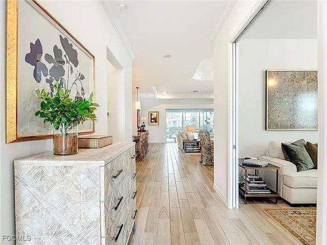 a large kitchen with lots of counter space dining table and stainless steel appliances
